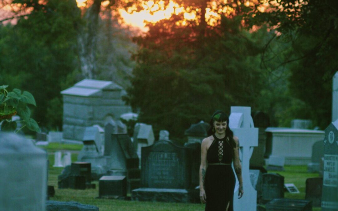 Rene Walter walks through a graveyard with a smile.