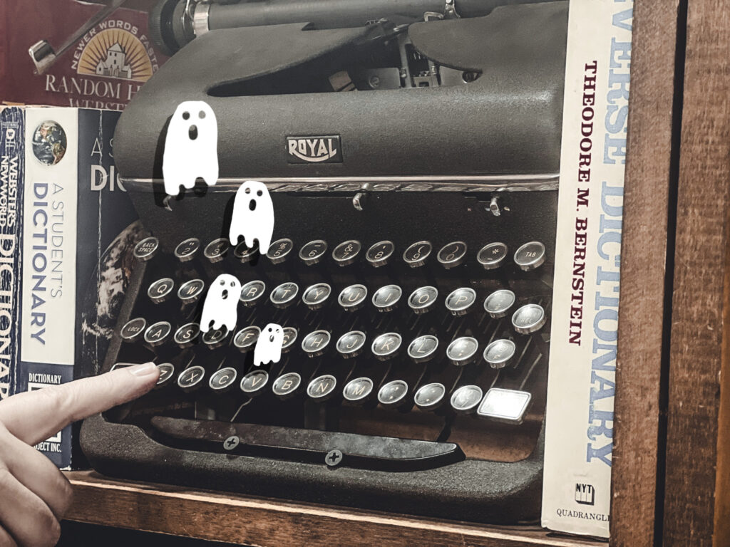 Cartoon ghosts fly out of an old Royal typewriter displayed at the Capitol Hills Book Store.